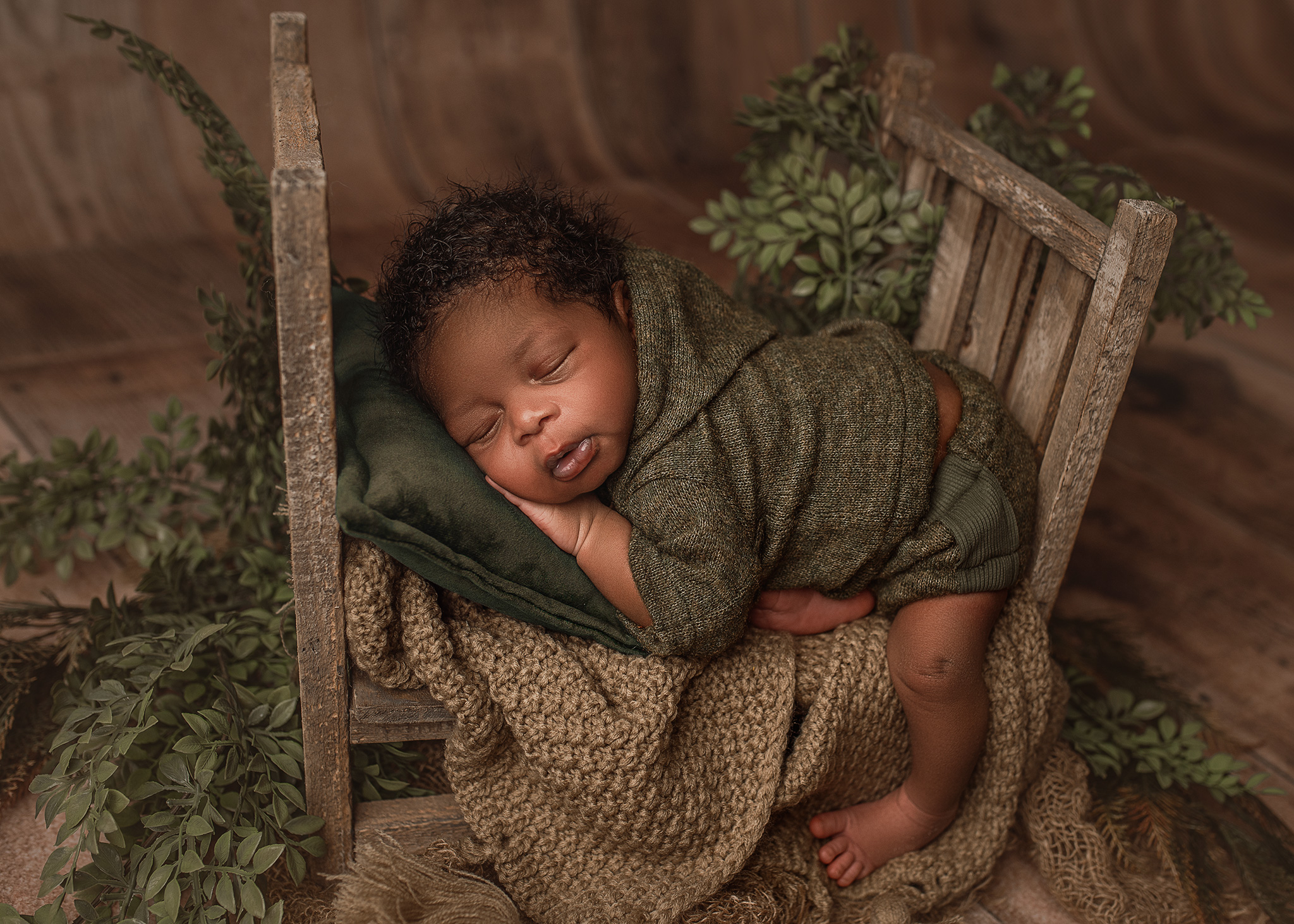 newborn boy on bed prop, full service newborn photography, nebraska photographers, family photographer near me, lincoln ne family photos, kansas city newborn photographer