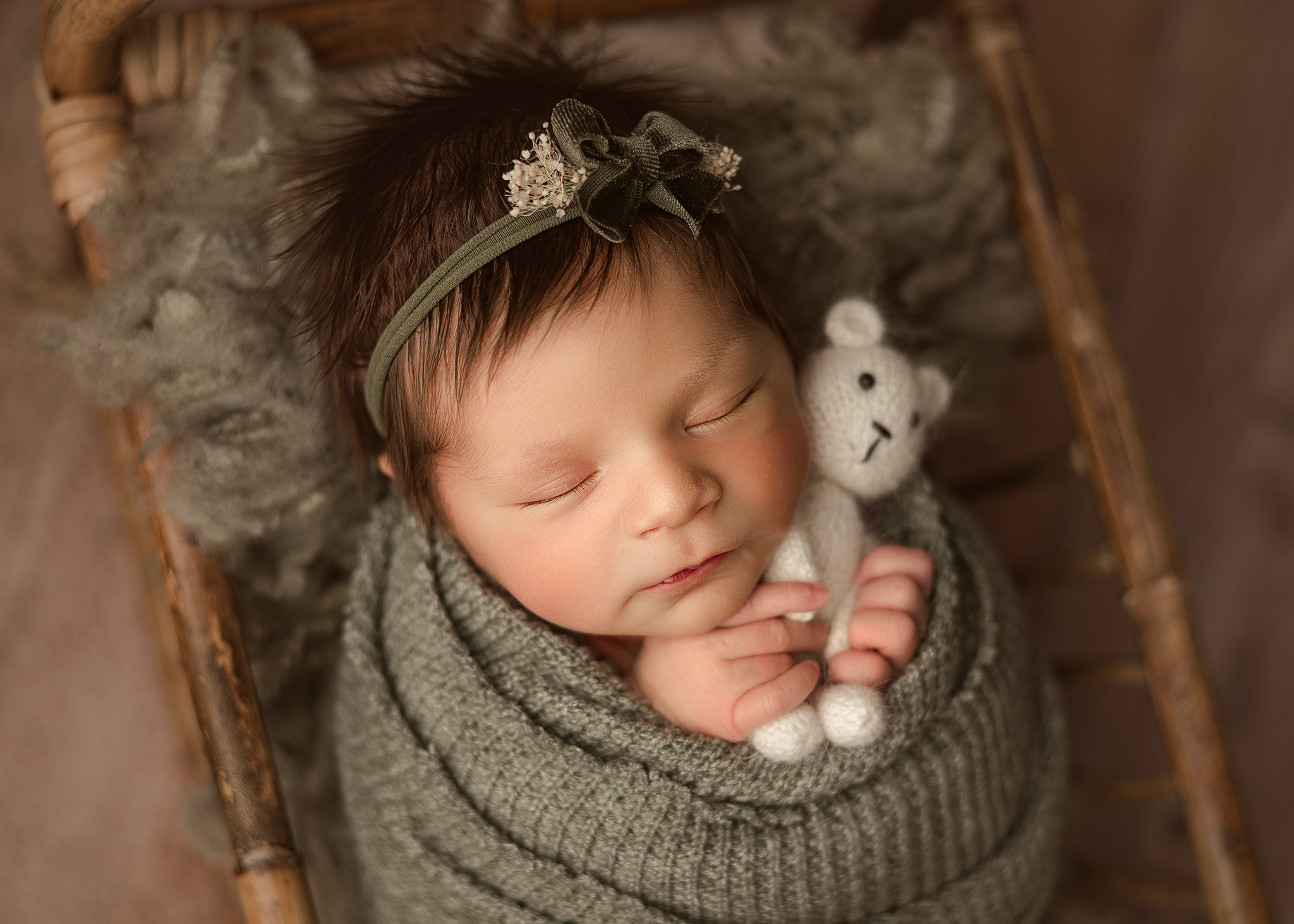 Professional newborn photo of baby girl in basket, Omaha NE newborn photographer